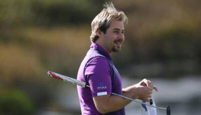 Young French musketeer Victor Dubuisson bloodied but unbowed 