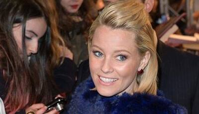 Elizabeth Banks reveals J Law is obsessed with 'close-up magic'