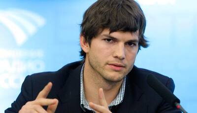 Ashton Kutcher compares newborn babies to phones