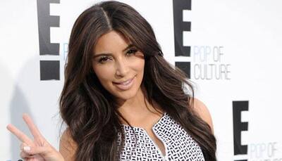Kim K doesn't smile in pics due to wrinkles