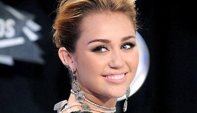 Miley Cyrus dons Elvis Presley's look