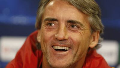 Roberto Mancini `fine` after being swept off his feet