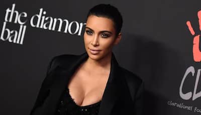 Kim Kardashian flaunts cleavage for 'Selfish'