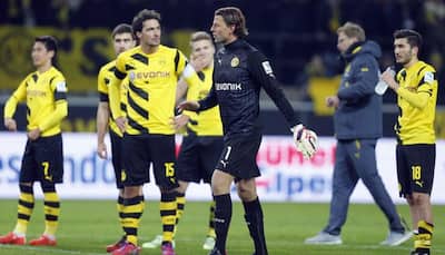 Borussia Dortmund lose to 10-man Augsburg as crisis deepens
