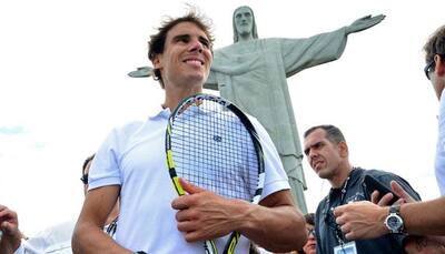 Rafael Nadal limbers up for Rio defense, carnival 