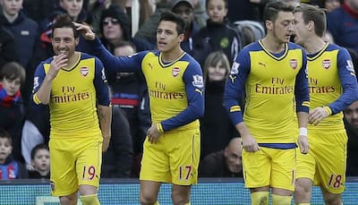 Arsenal survive Crystal Palace rally to go third