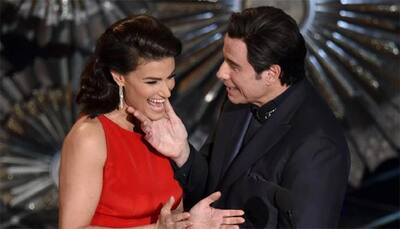Travolta's 'awkward' run-ins with Scarlett, Idina at Oscars