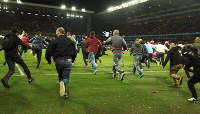 FA launch probe into Aston Villa pitch invasions