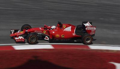 Sebastian Vettel turns air blue, paints town red