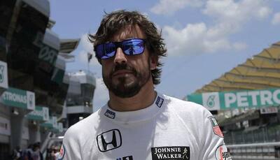 Fernando Alonso stays positive while Ferrari celebrate