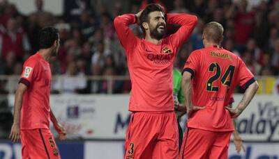 Barcelona blow two-goal lead at Sevilla, leave La Liga title race wide open