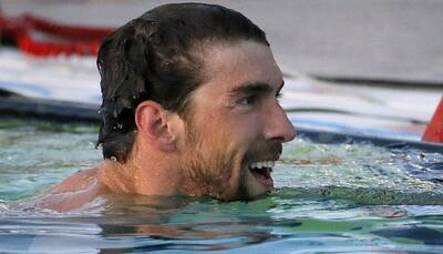 Michael Phelps wins on return, could get world champs invite