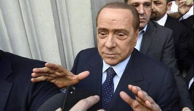 Silvio Berlusconi cools takeover talk, not investment 