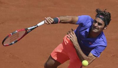 Roger Federer wins at Roland Garros, dodges fan scare