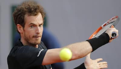 Murray overcomes tricky conditions in opening win 