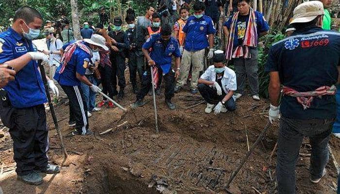 Malaysia arrests 12 cops over link to migrants&#039; mass graves