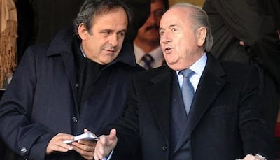 UEFA chief Michel Platini asks FIFA boss Sepp Blatter to step down