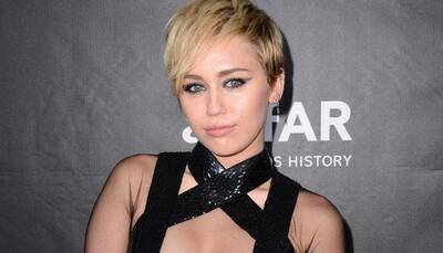 Miley Cyrus flaunts her bosom