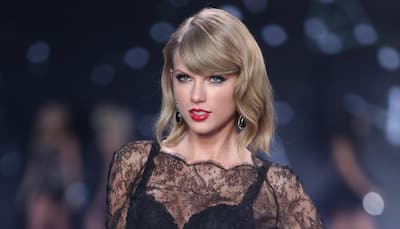 Taylor Swift hikes backwards to avoid paparazzi