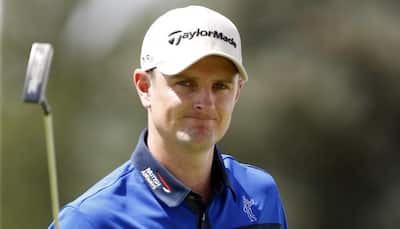 Tiger Wood`s career-worst round overshadows Justin Rose in lead