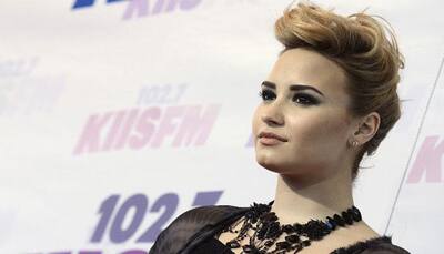 Lovato replaces Perry as voice of Smurfette in 'Get Smurfy'