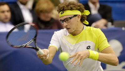 Denis Istomin into Nottingham final as Marcos Baghdatis retires