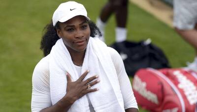 Serena Williams overcomes early wobble to ease through
