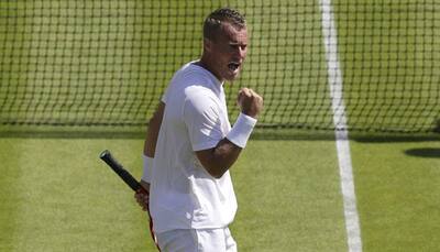 Lleyton Hewitt hanging tough in Wimbledon last waltz