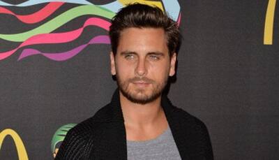 Scott Disick cozies up to another woman