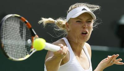 Wimbledon: Caroline Wozniacki downed by Garbine Muguruza in fourth round