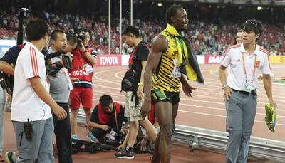 WATCH: After historic Gold, a cameraman knocks down Usain Bolt!