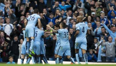 Manchester City flex muscles as English clubs break spending record