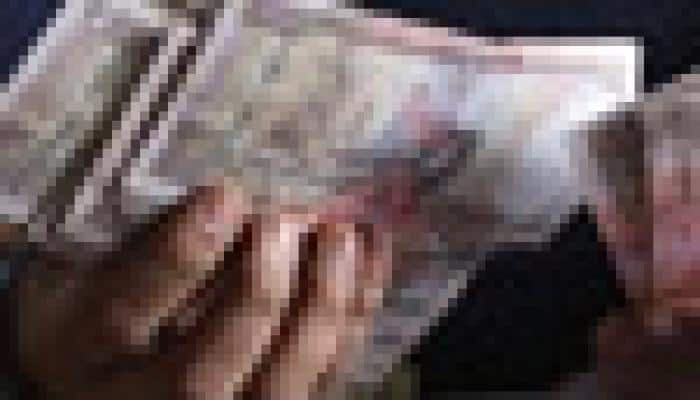 Rupee down 7 paise at 61.48 against US dollar 
