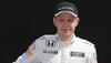 McLaren's Kevin​ Magnussen falls off bike and breaks hand