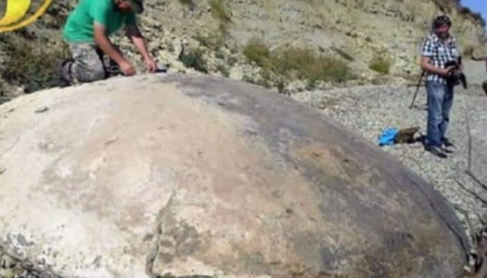 Watch: UFO hunters find stone disc from alien spacecraft