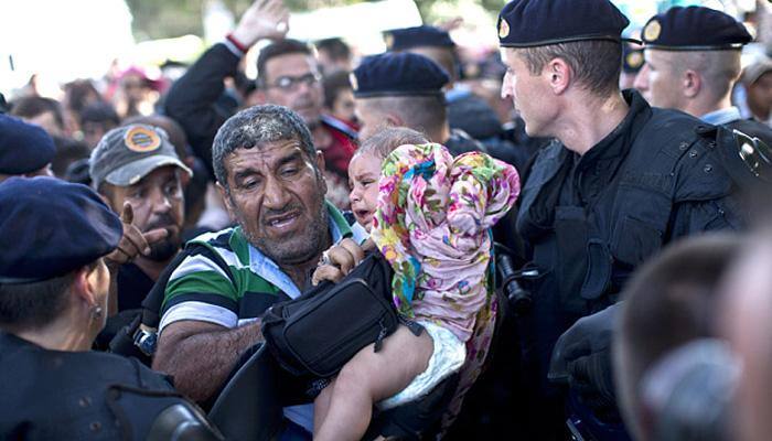 Croatia and Serbia trade insults as Hungary builds new migrant barrier