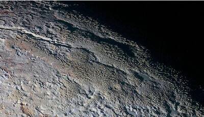 'Snakeskin' photos reveal Pluto in dazzling details