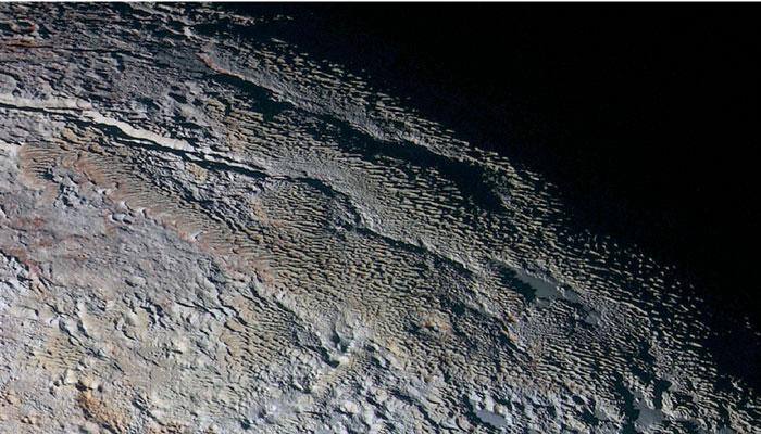 'Snakeskin' photos reveal Pluto in dazzling details