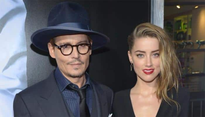 Amber Heard left in tears on charity outing with Johnny Depp