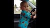 Baby dancing inside car