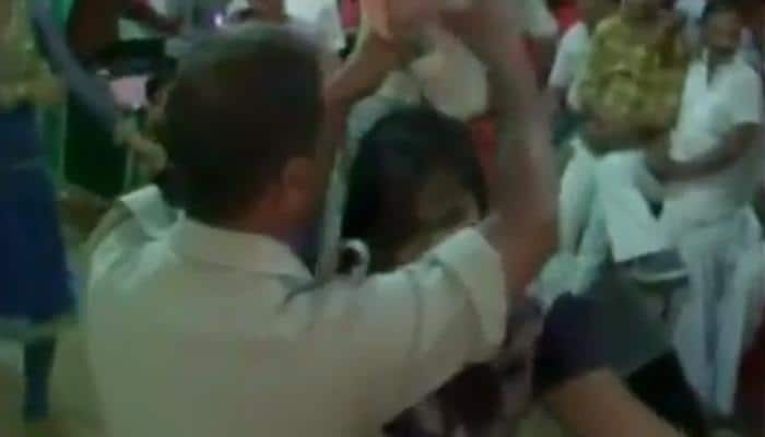 Watch – Policemen in uniform shower money on bar dancers in Varanasi