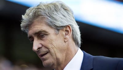 Manchester City manager Manuel Pellegrini brings wrong passport to airport