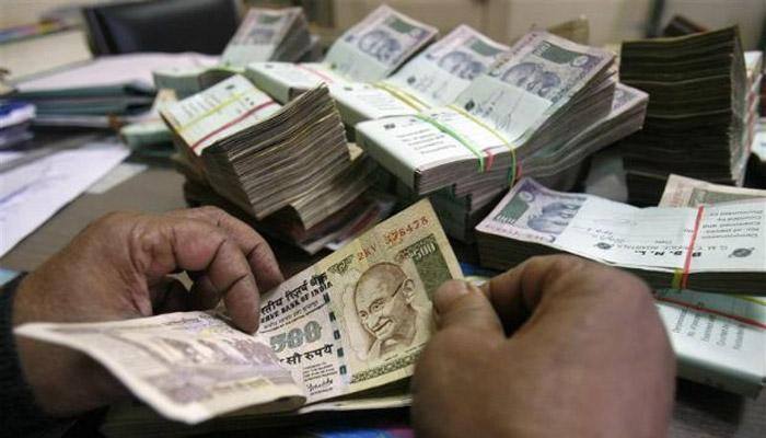 Rupee gains 12 paise at 65.29 against dollar 