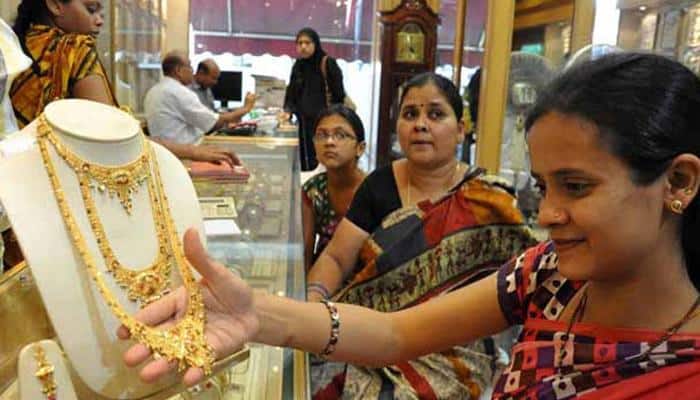 Gold, silver tumble on weak global cues and low demand
