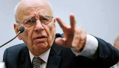 Murdoch says Obama not a 'real black president', apologises