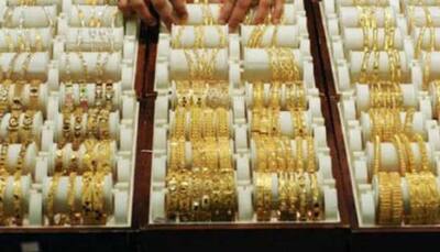 Gold weakens on sluggish demand; silver firms up