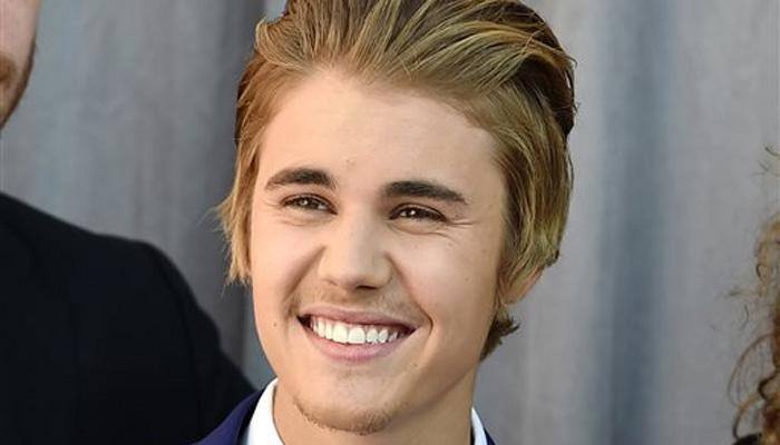 Justin Bieber goes nude, then threatens action 