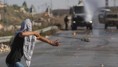 Palestinian killed, Arab attacks Israelis as unrest mounts