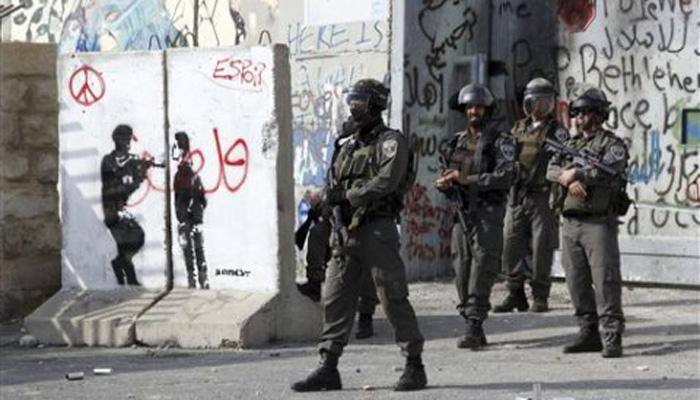 As tensions rise, Israel erects wall to protect Jews in East Jerusalem