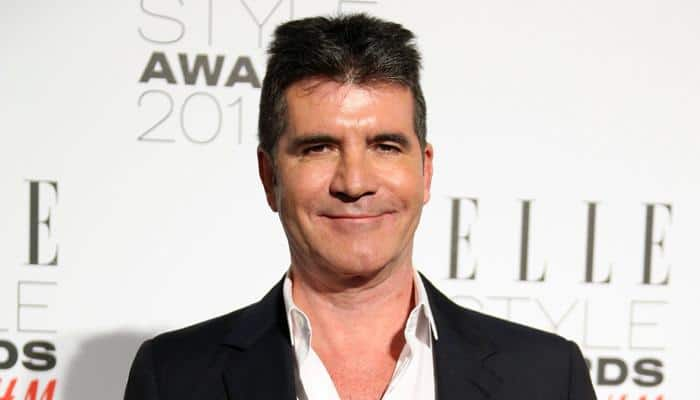 Simon Cowell gives Louis Tomlinson fatherhood advice